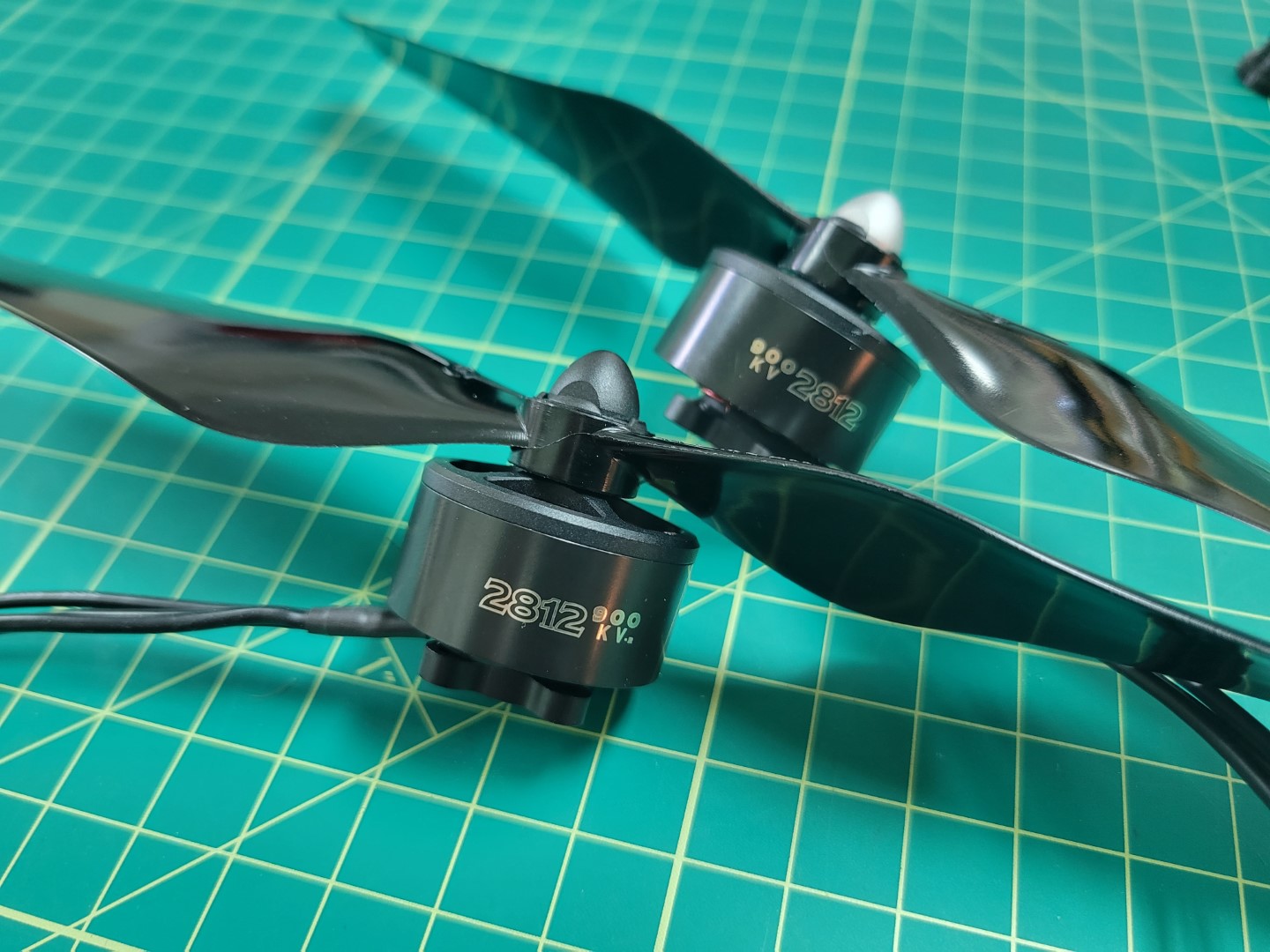 CW (black cap) and CCW (silver cap) motors