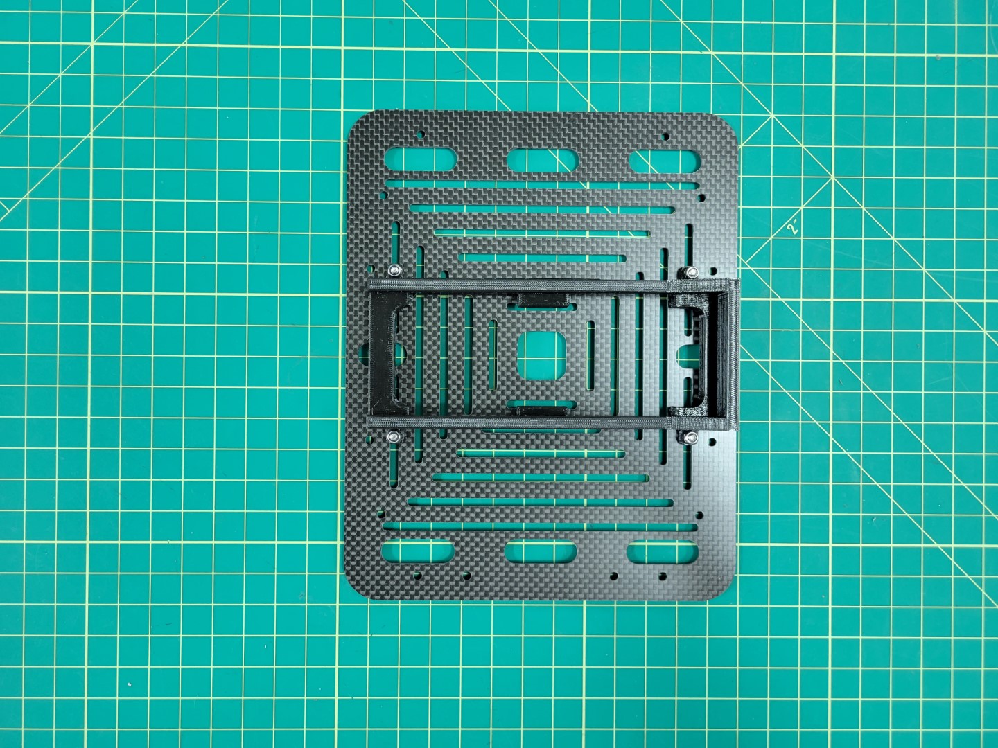 Battery try mounted to accessory plate