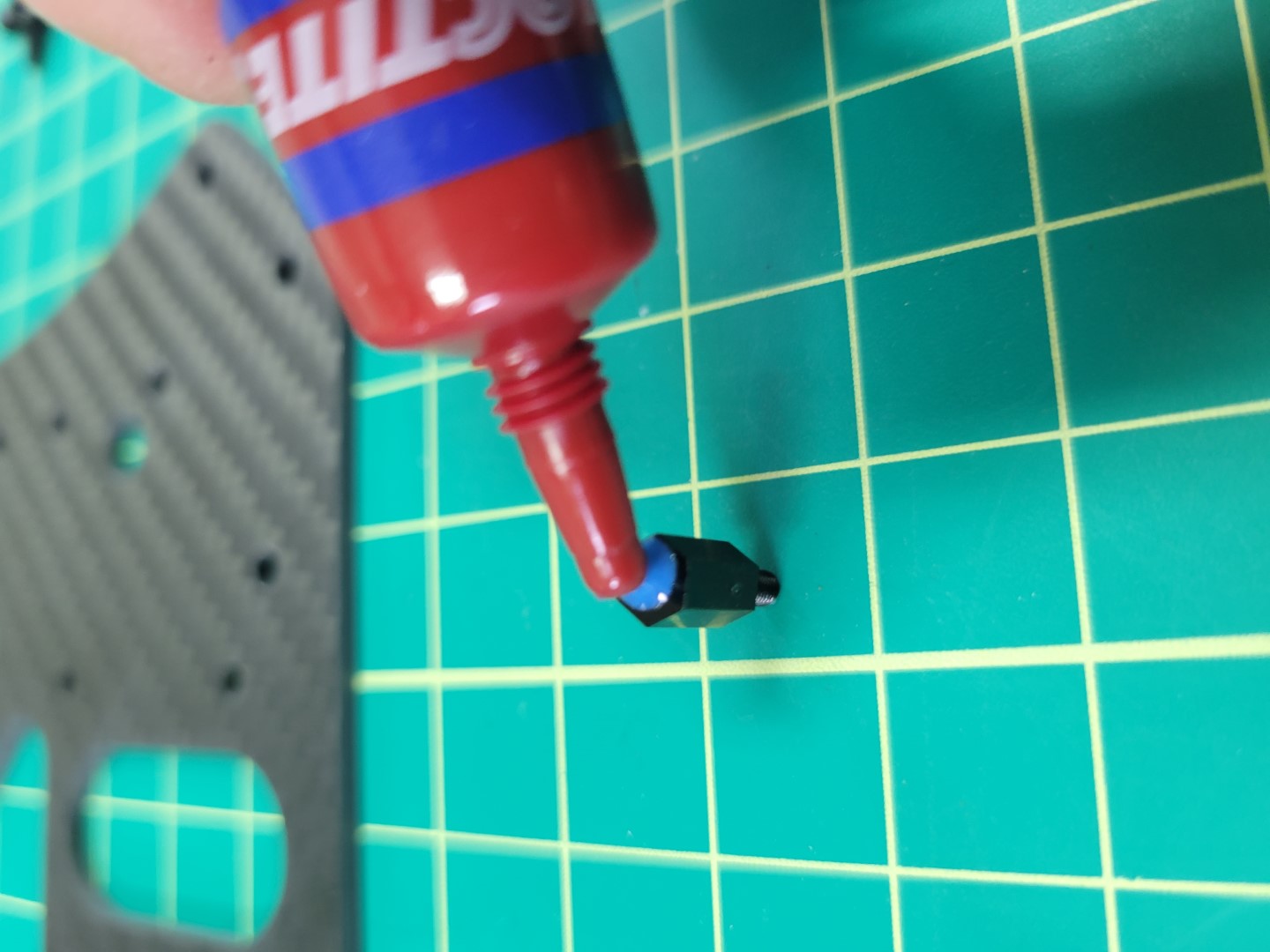 Applying blue Loctite to 6mm nylon standoff