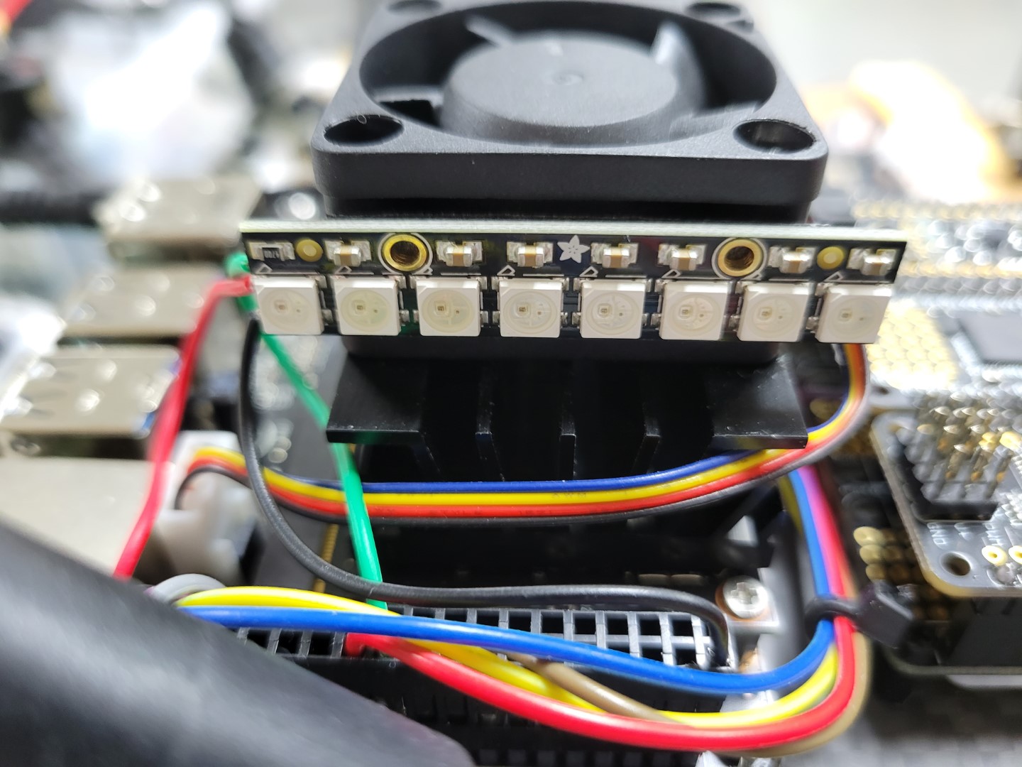 LED mounted on rear side of cooling fan